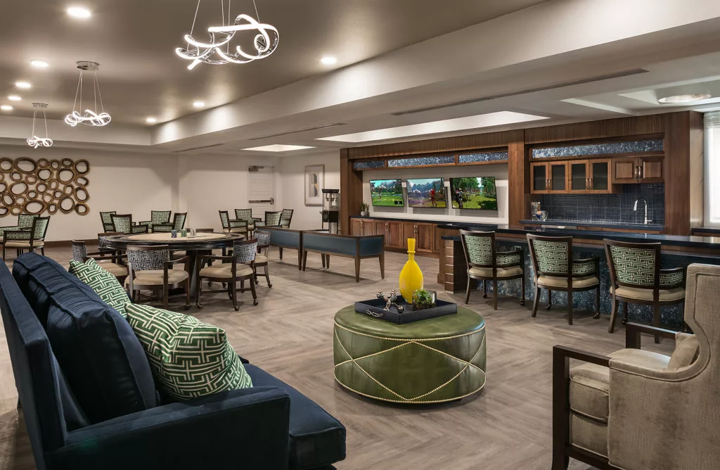 A modern lounge area with stylish furniture and contemporary lighting.
