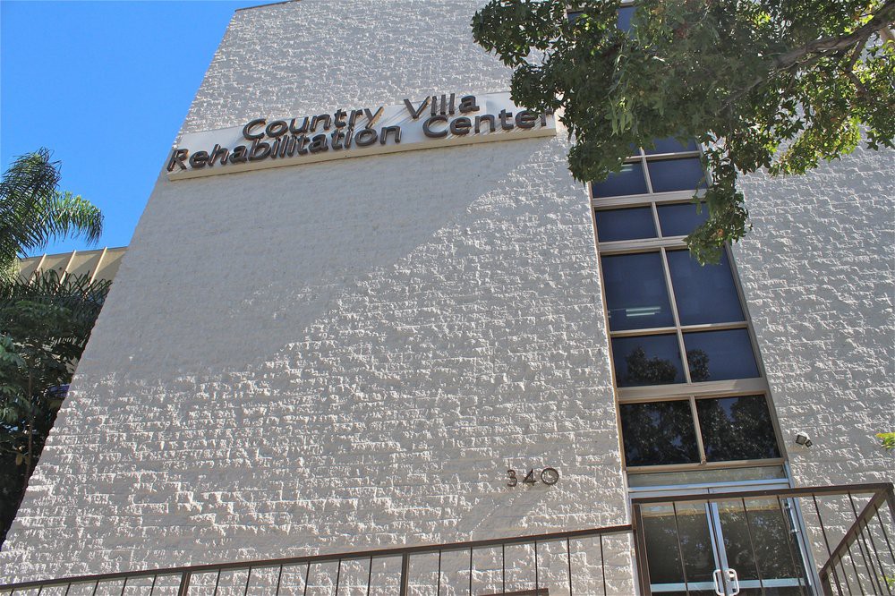 The exterior of Country Villa Rehabilitation Center with visible signage during the daytime.
