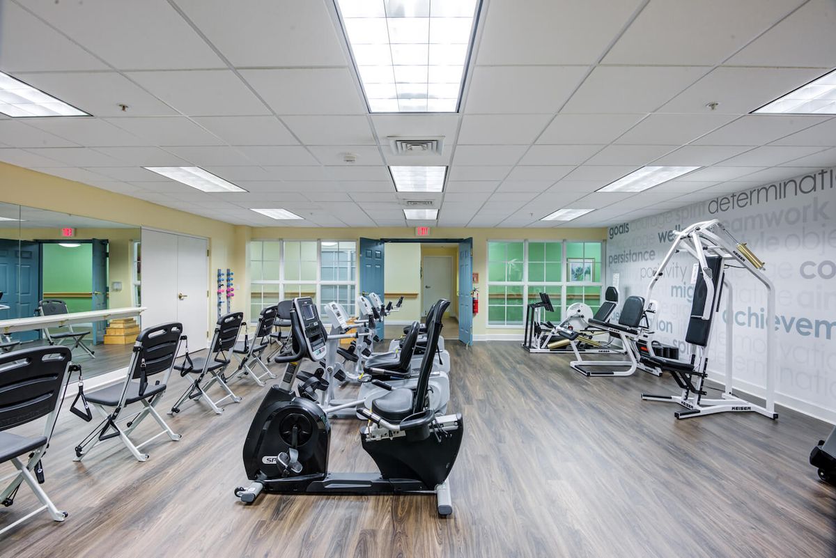 A modern gym equipped with various exercise machines.