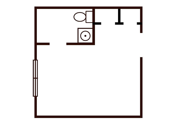 A simple floor plan featuring a bathroom with a toilet and sink.
