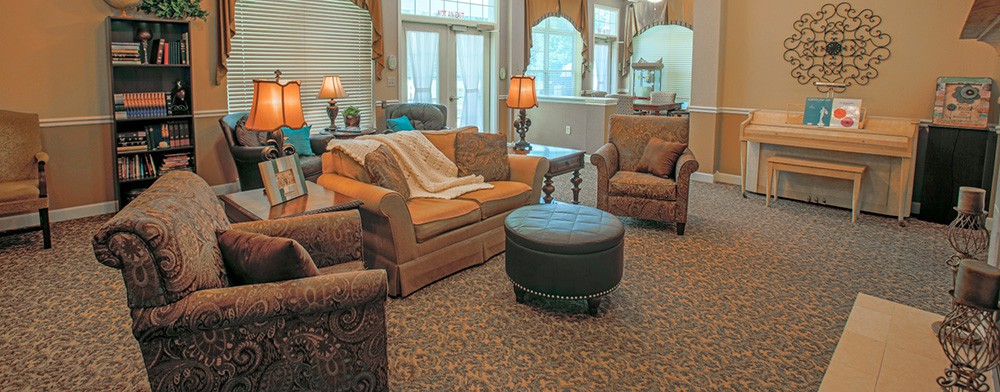 A cozy living room with comfortable seating and warm lighting.