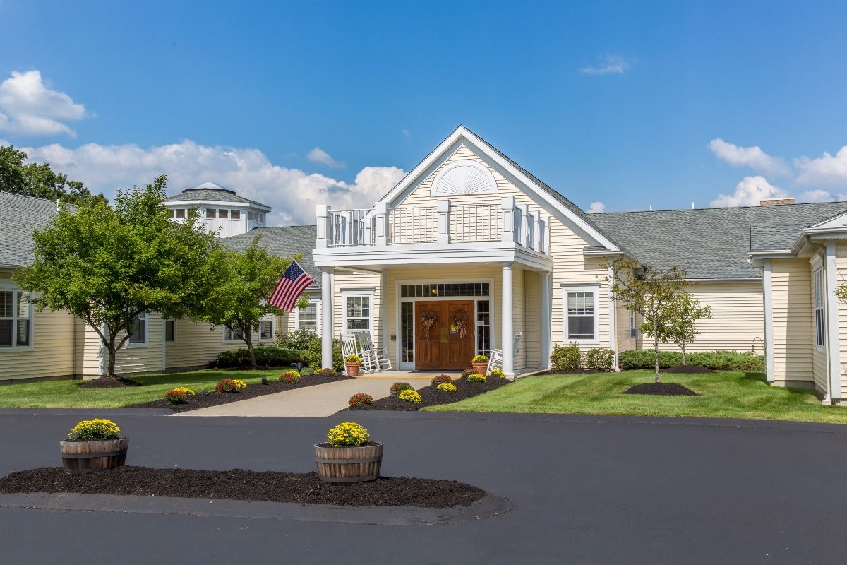 A charming residential building with a well-maintained entrance and landscaping.