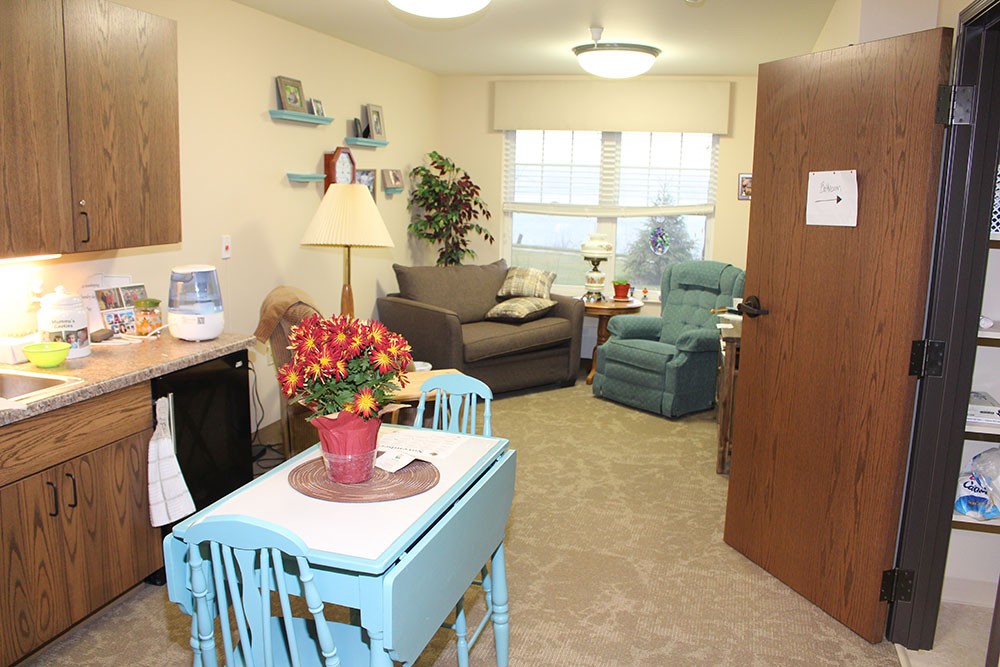 A cozy living room with comfortable seating and vibrant decor.