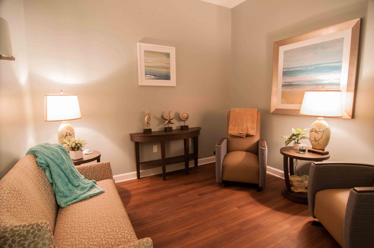 A warm and inviting living room with comfortable seating and soft lighting.