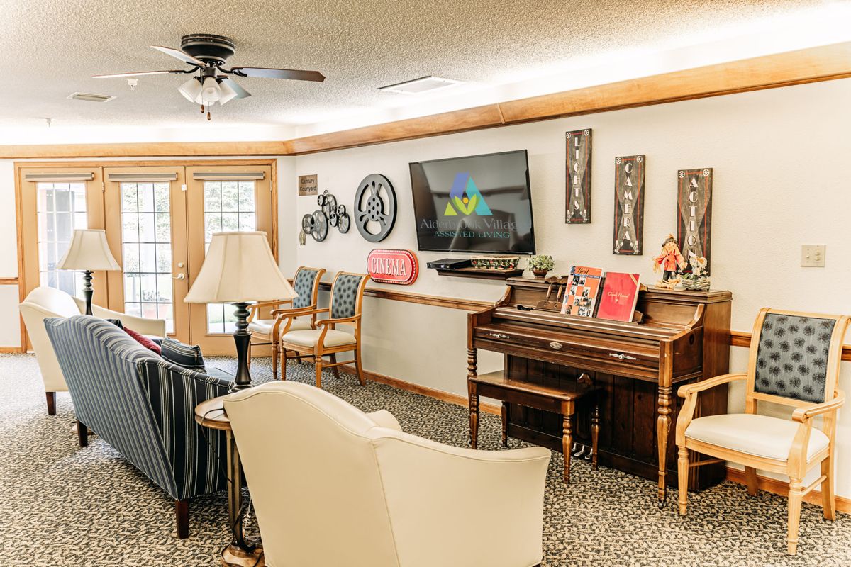 A cozy living room with a piano and modern decor.