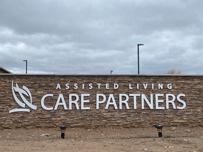 Sign for Care Partners Assisted Living facility outdoors.