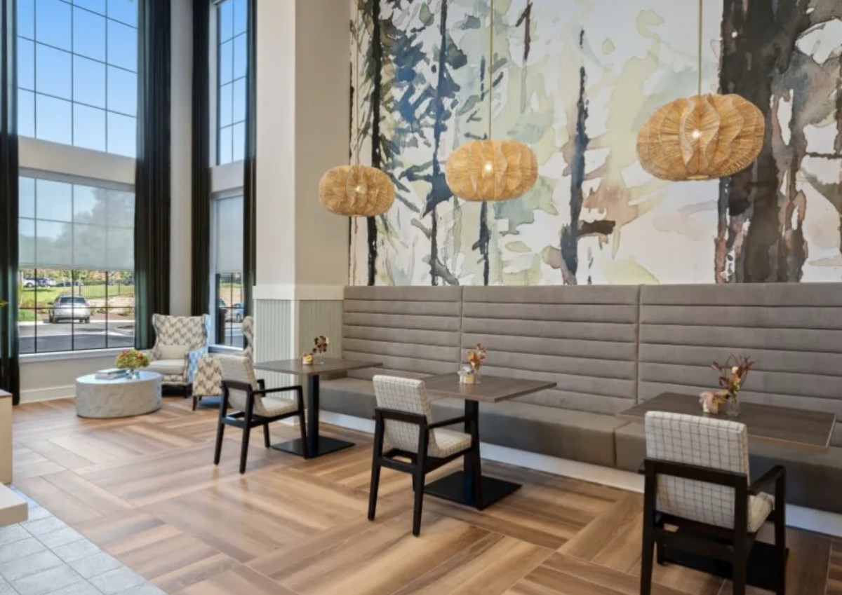 A modern restaurant interior with elegant decor and seating arrangement.