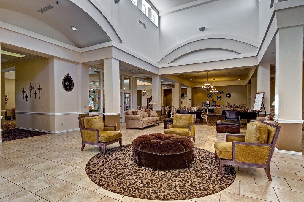 A spacious and elegantly designed hotel lobby featuring comfortable seating and modern dcor.