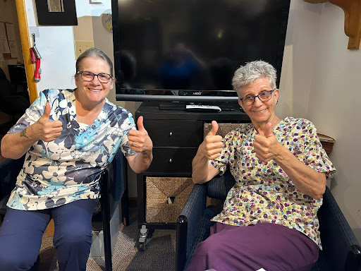 Two friends enjoying their time together with smiles and thumbs up!