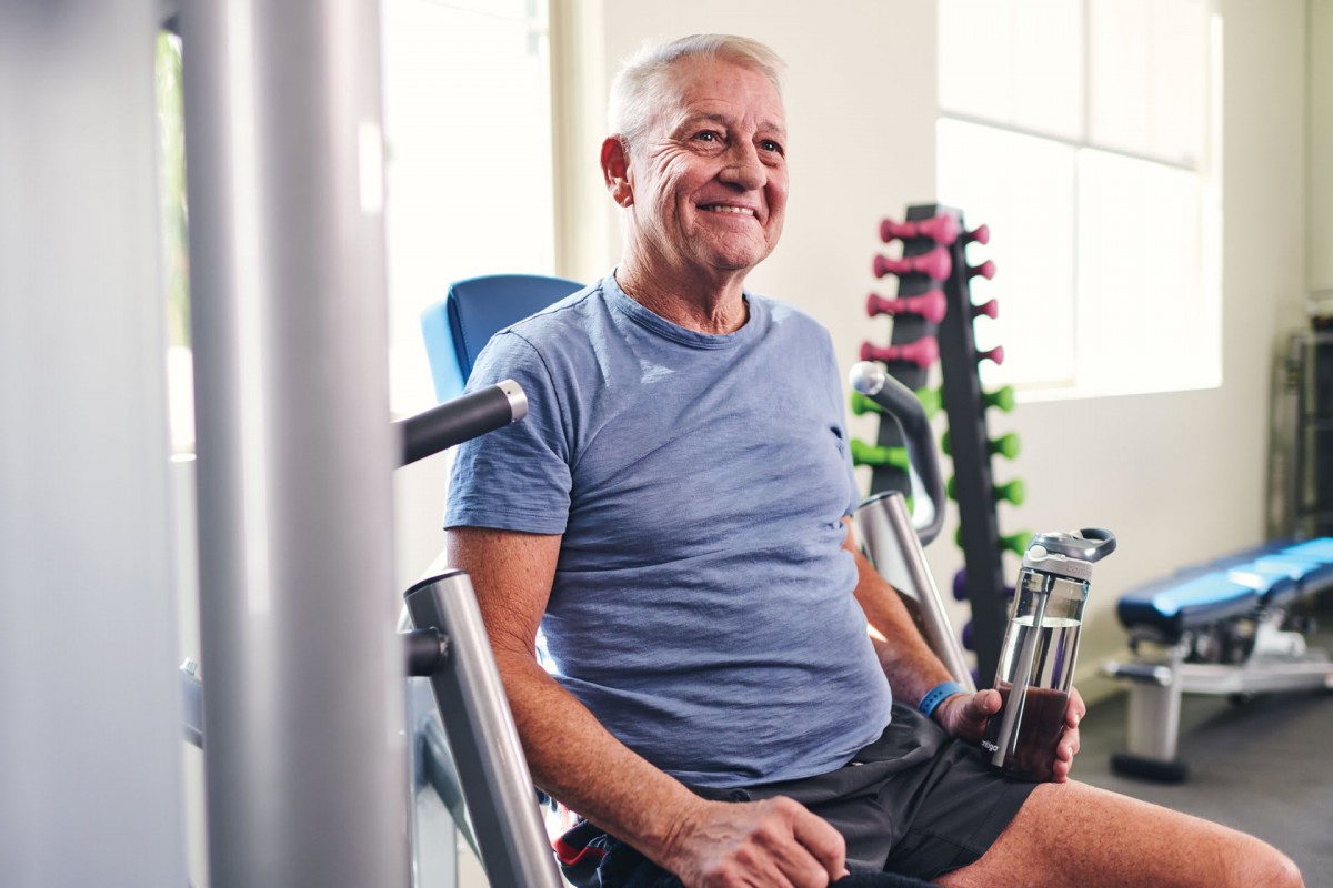 A senior man enjoying a workout in the gym.