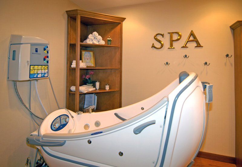 A relaxing spa room featuring a modern therapy machine.