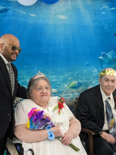 A joyful couple celebrating their special day with an underwater backdrop.