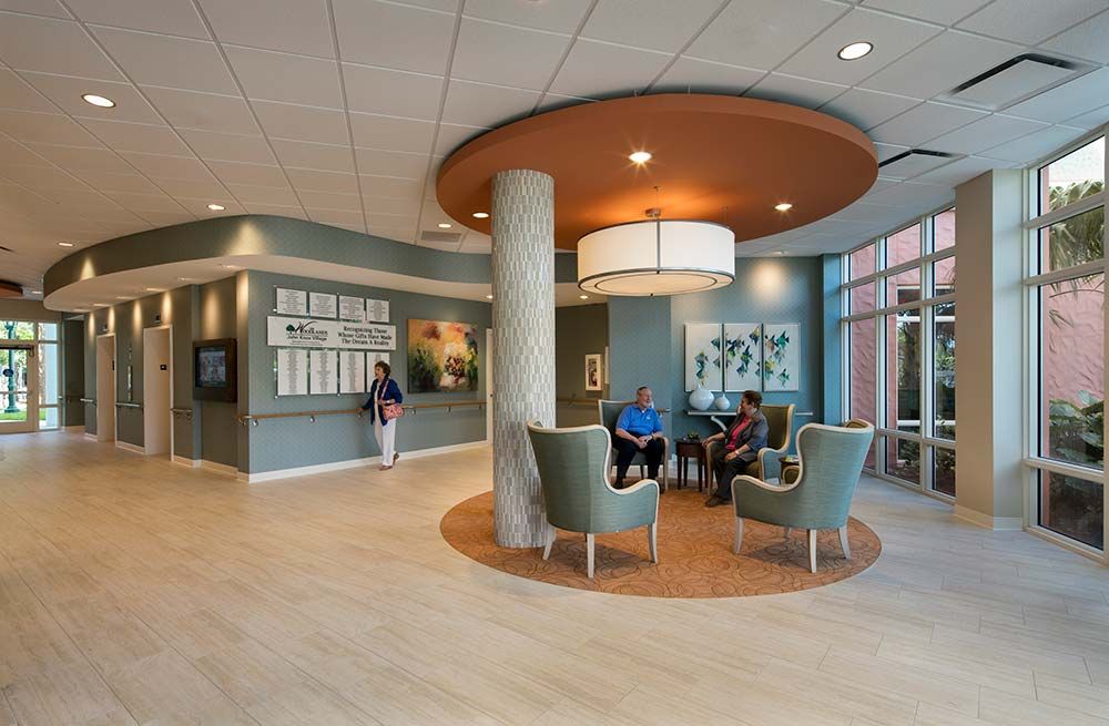 A modern waiting area with comfortable seating and ambient lighting.