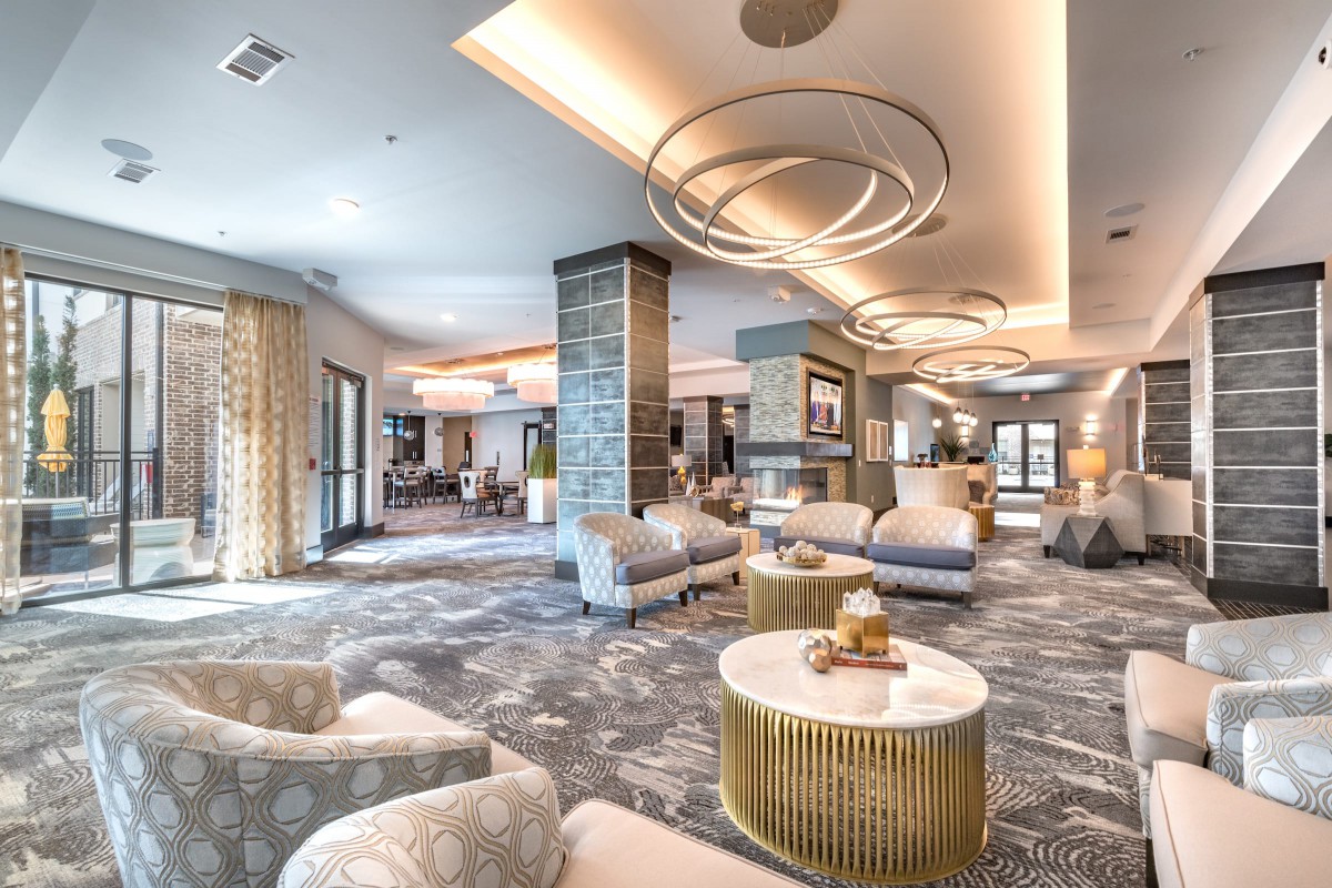 A luxurious and modern hotel lobby with comfortable seating and elegant lighting.