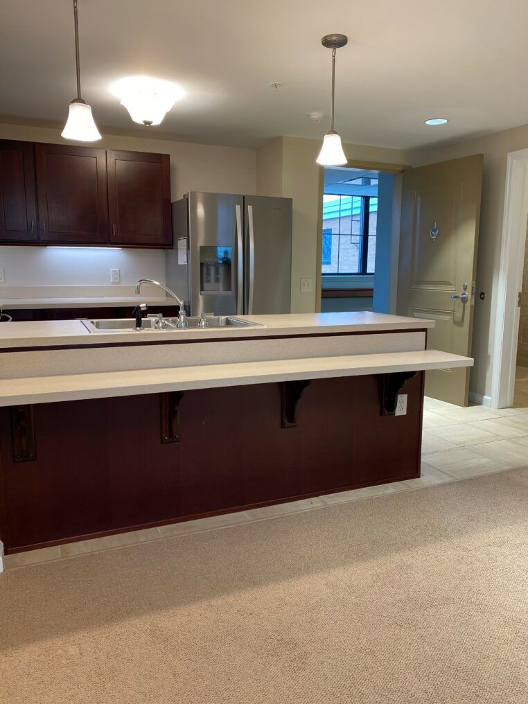 A modern kitchen interior with a spacious countertop and sleek cabinets.