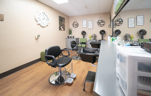 A cozy hair salon interior featuring styling chairs and a relaxing atmosphere.