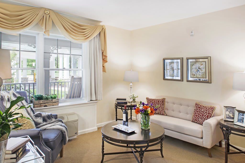 A cozy living room with elegant furnishings and decor.