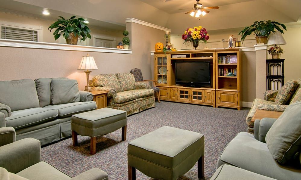 A cozy living room with comfortable seating and a television.