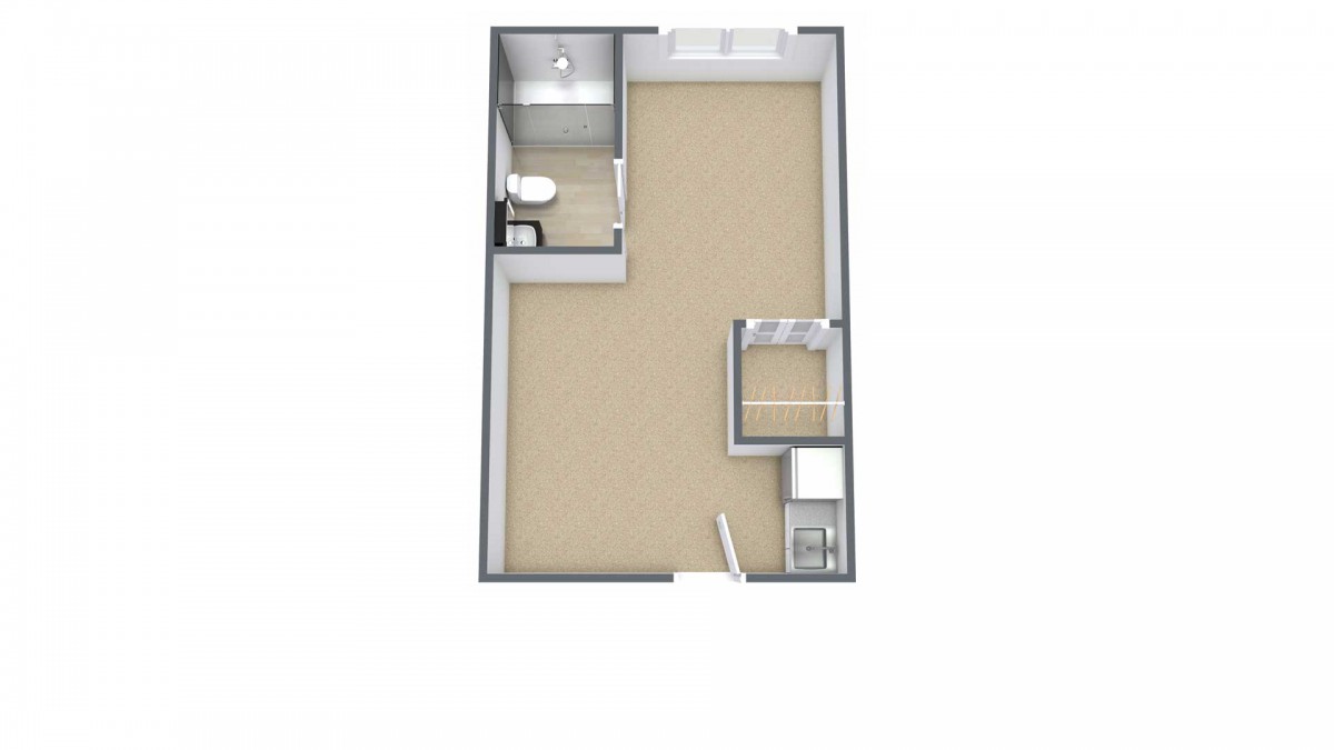 A simple floor plan of a small apartment featuring a bathroom, main living space, and kitchen area.