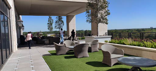 A serene outdoor seating area featuring stylish furniture and a beautiful landscape.