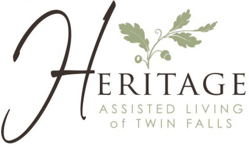 Logo for Heritage Assisted Living of Twin Falls featuring stylized text and an oak leaf design.