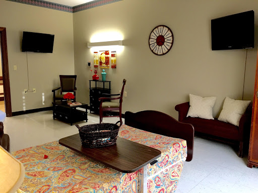 A cozy living room setup featuring comfortable seating, decorative elements, and entertainment options.