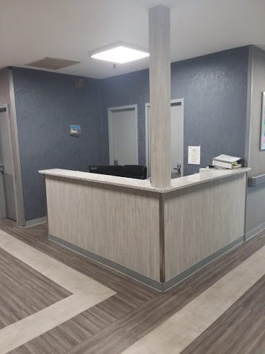 A modern and minimalistic reception area in a healthcare facility.