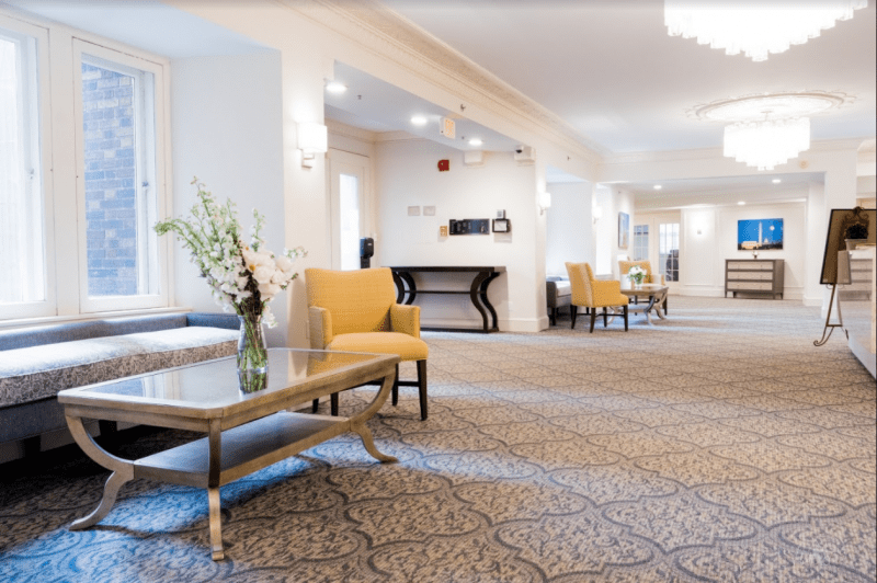 A spacious hotel lobby with comfortable seating and elegant decor.
