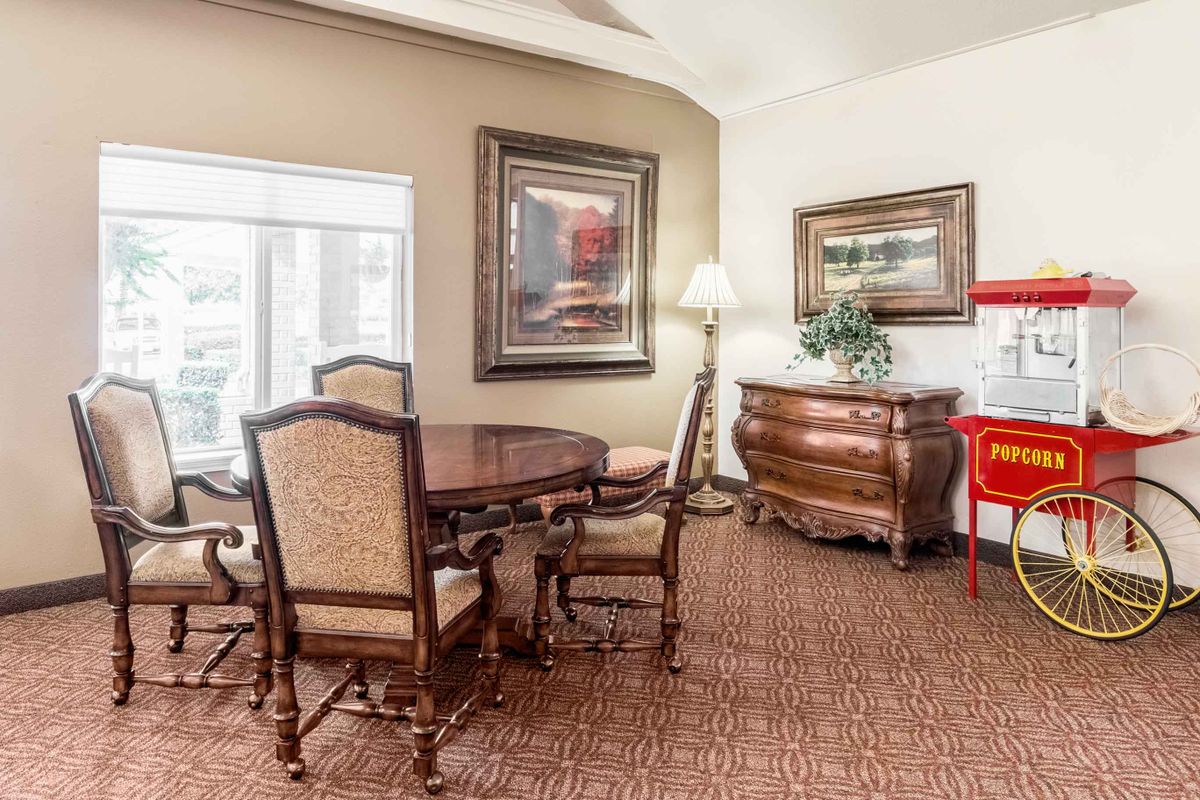 A classic dining room with elegant furniture and decorative elements.