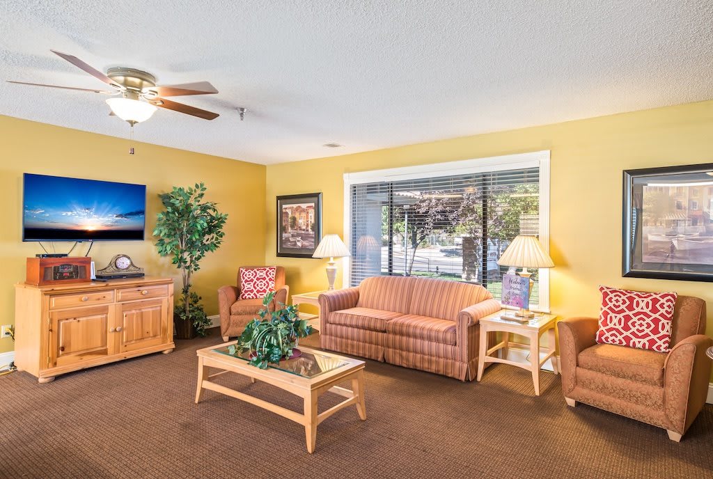 A cozy living room with comfortable seating and a television.
