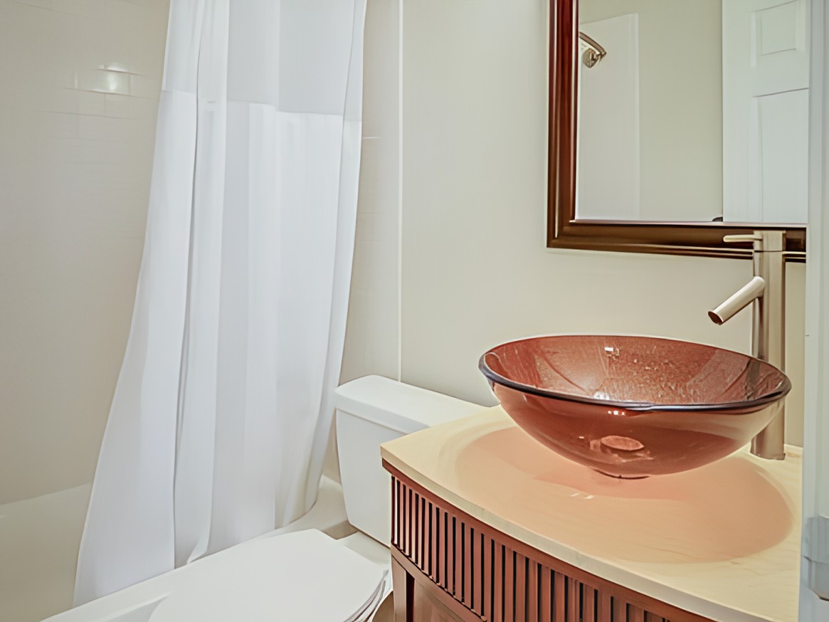 Modern bathroom with a vessel sink and shower.