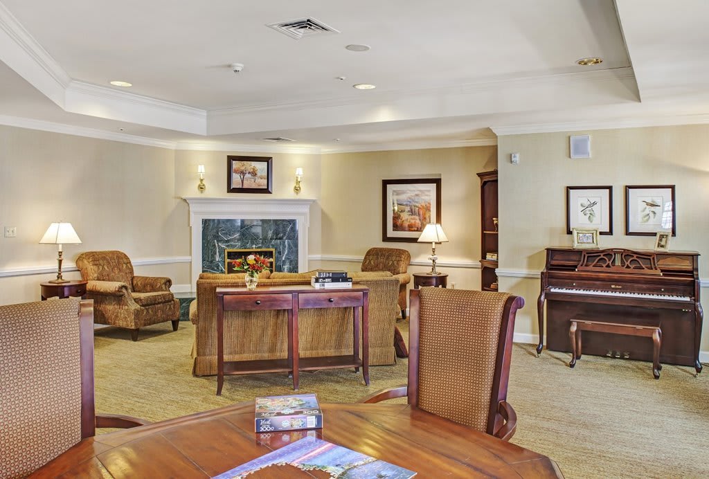 A cozy living room with a fireplace and comfortable seating arrangements.