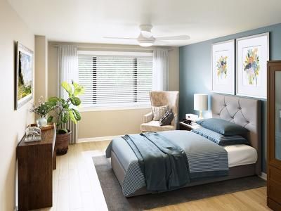 Modern bedroom with a cozy design, featuring a large bed and abundant natural light.