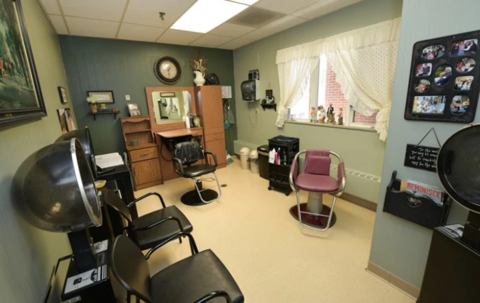 A cozy hair salon interior with styling chairs and mirrors.