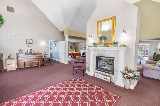 A cozy and inviting living room featuring a stylish fireplace and elegant decor.