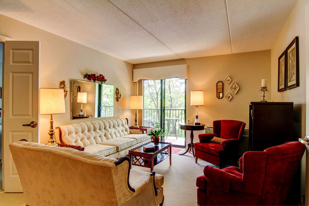 A cozy vintage-style living room with elegant furniture and soft lighting.