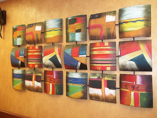 A vibrant display of abstract artwork, showcasing a variety of colors and geometric designs arranged in a grid format.