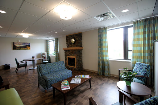 A cozy living room setting with comfortable seating and natural light.