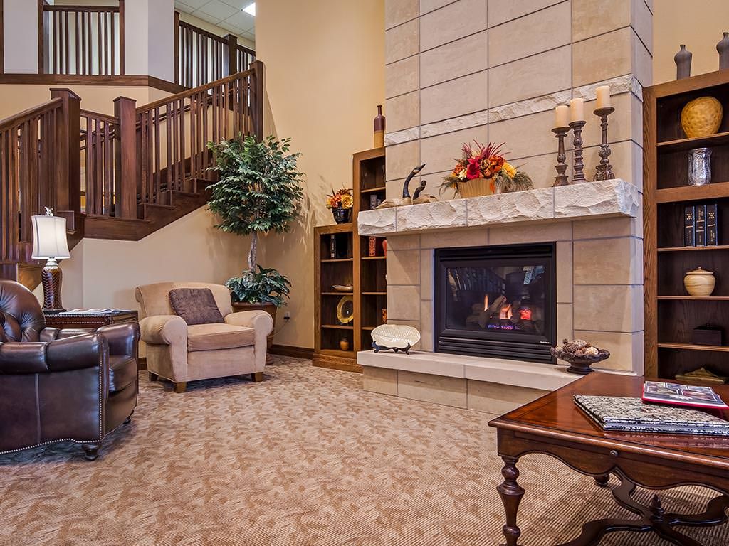 Cozy living room with a warm fireplace and comfortable seating.