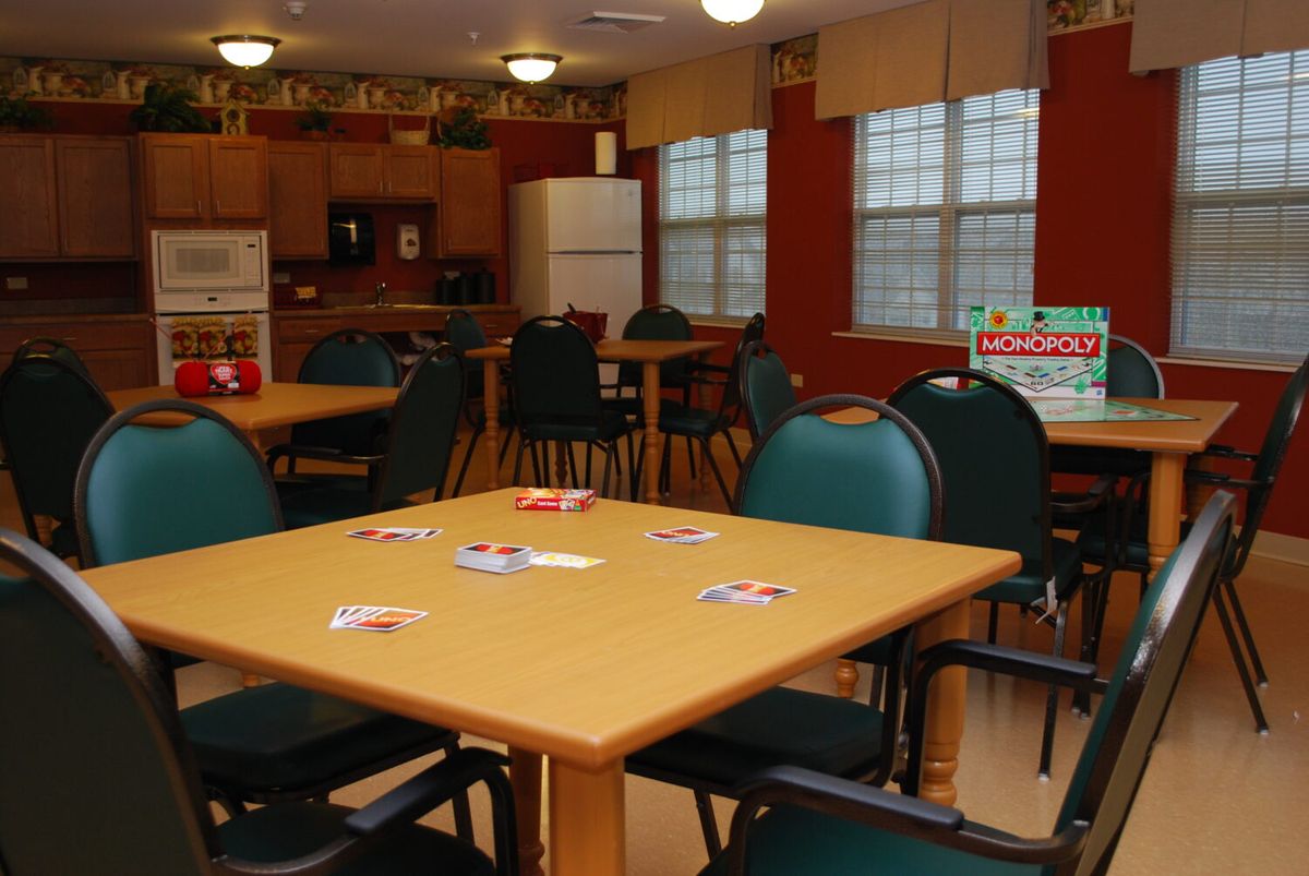 A community dining area with tables set up for card games.
