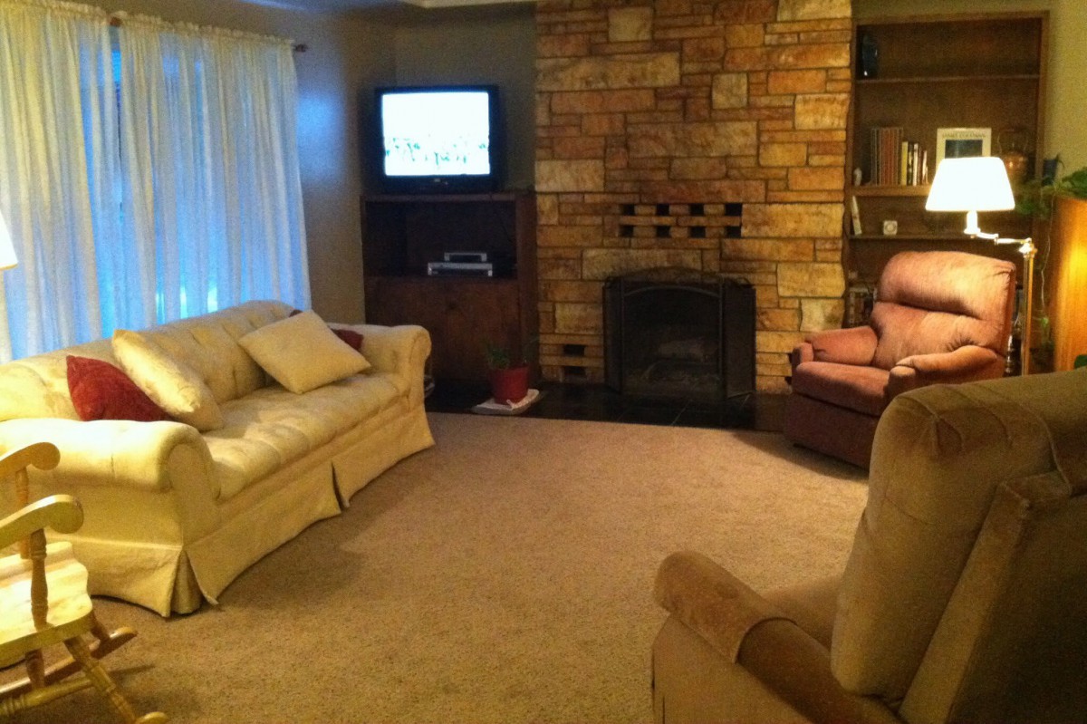 Cozy living room with a fireplace and comfortable seating.