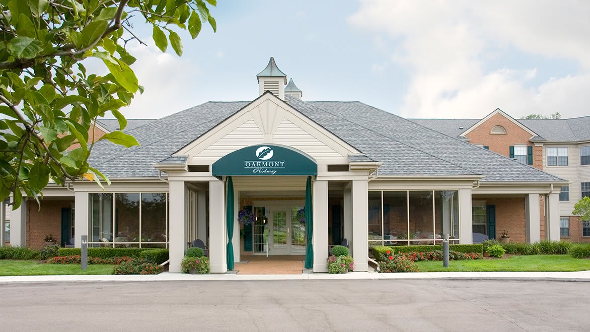 Front view of a commercial building entrance with signage.