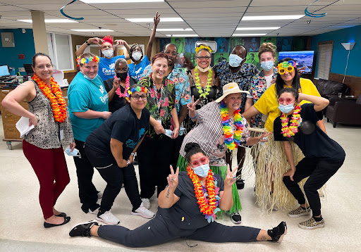 A lively group celebrating in themed costumes, showcasing joy and unity.
