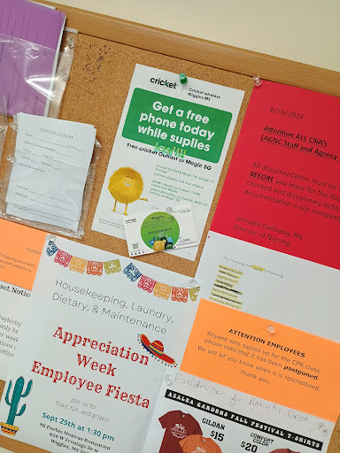 A bulletin board displaying various announcements and events related to employee appreciation and holidays.