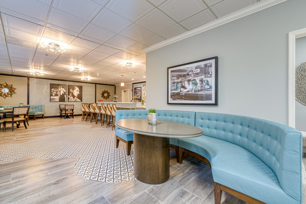 A modern dining area with booth seating and stylish decor.