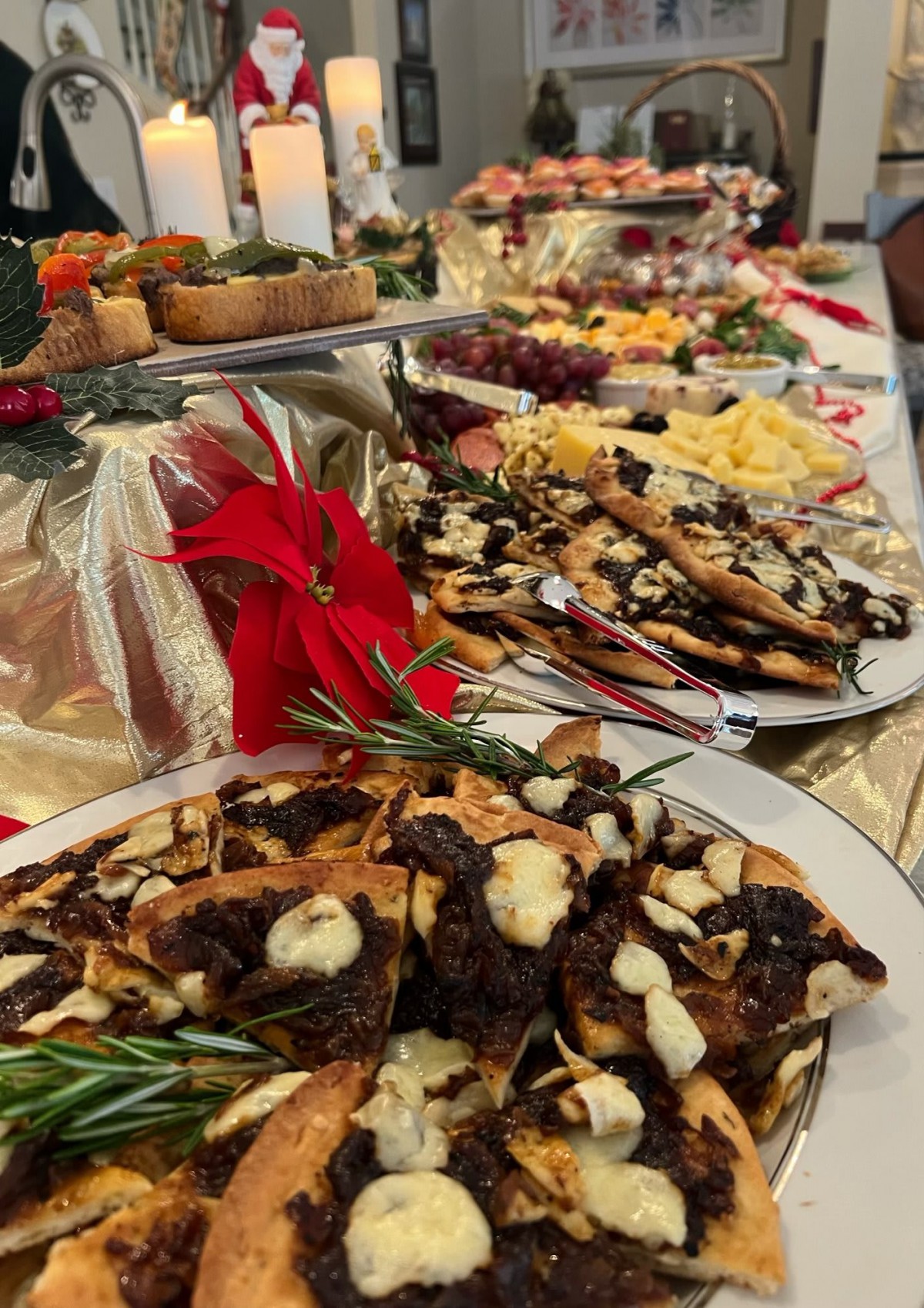 A festive buffet spread featuring a variety of desserts and holiday-themed decorations.