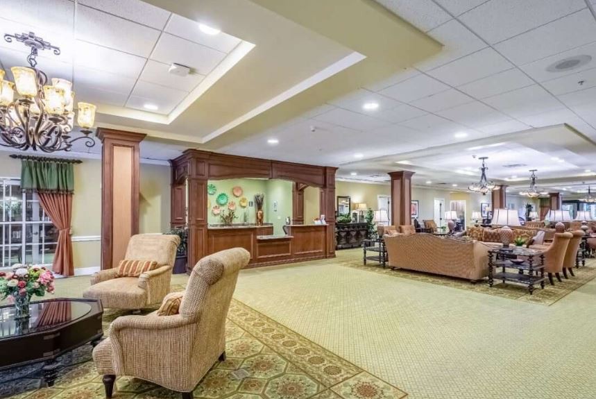 A spacious and elegantly designed lobby with comfortable seating and warm lighting.