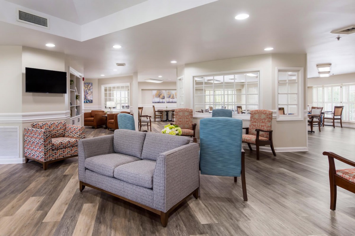 A modern living room with comfortable seating and bright lighting.