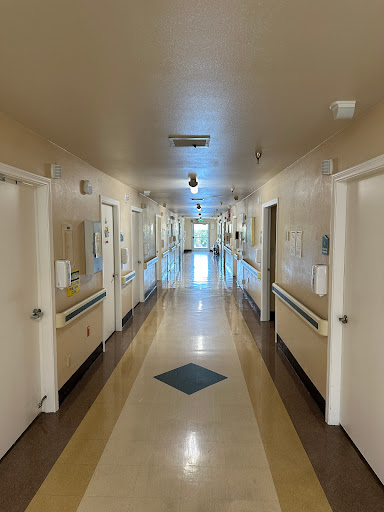 A view of a quiet hospital corridor.