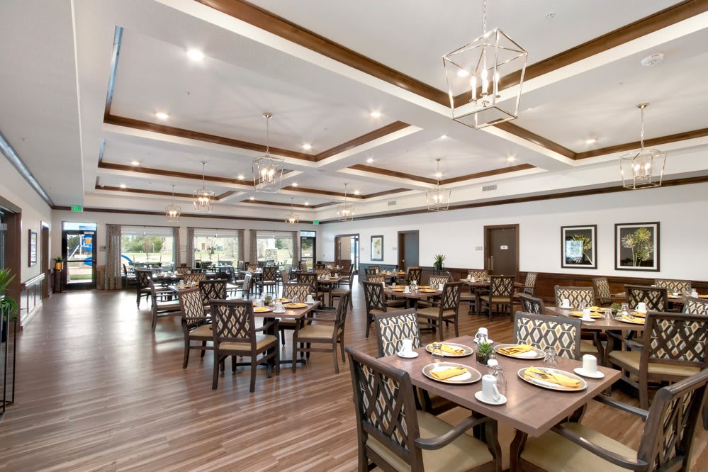Elegant restaurant dining area with well-arranged tables and stylish decor.